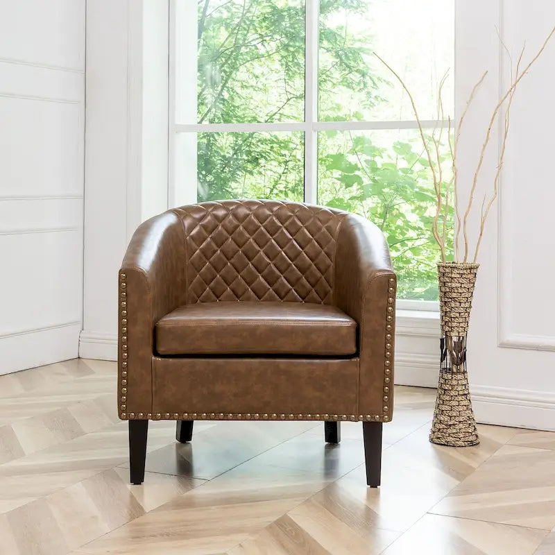 Poltrona club a botte in pelle PU trapuntata con borchie decorative