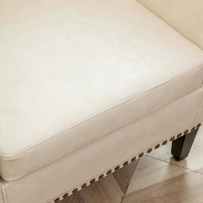 Poltrona club a botte in pelle PU trapuntata con borchie decorative