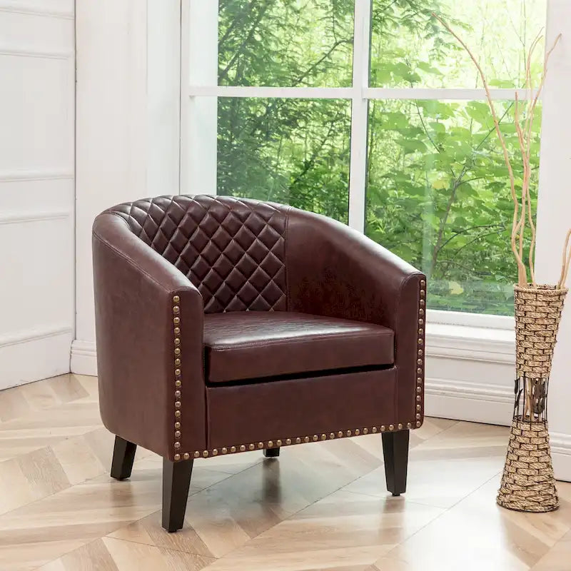 Poltrona club a botte in pelle PU trapuntata con borchie decorative