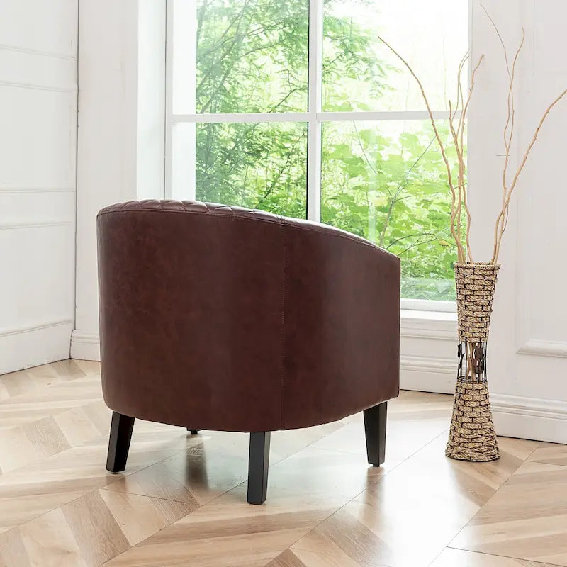 Poltrona club a botte in pelle PU trapuntata con borchie decorative