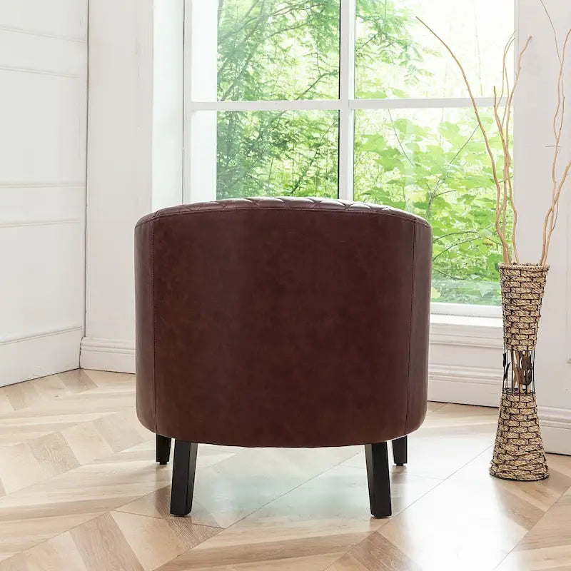 Poltrona club a botte in pelle PU trapuntata con borchie decorative