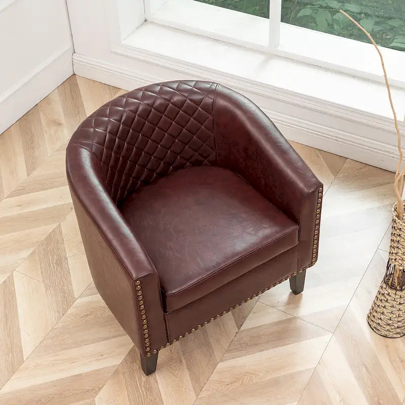 Poltrona club a botte in pelle PU trapuntata con borchie decorative