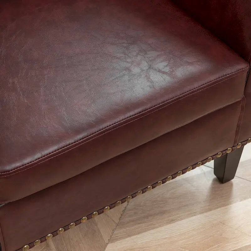 Poltrona club a botte in pelle PU trapuntata con borchie decorative