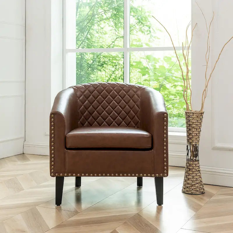 Poltrona club a botte in pelle PU trapuntata con borchie decorative