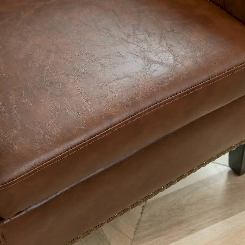 Poltrona club a botte in pelle PU trapuntata con borchie decorative