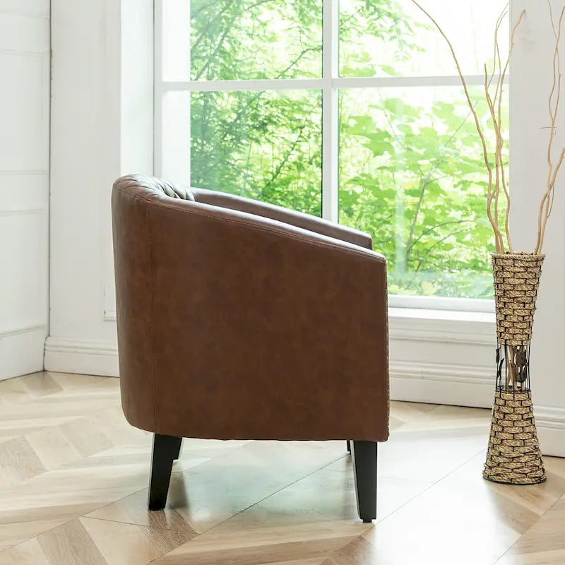 Poltrona club a botte in pelle PU trapuntata con borchie decorative